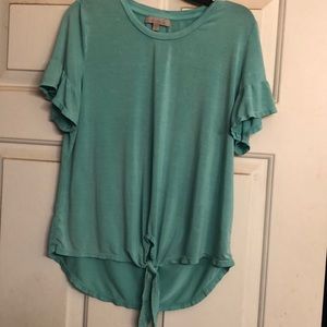 Department store, turquoise top